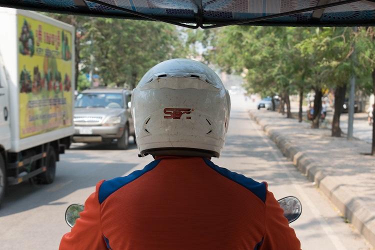 tuk tuk driver heading to Angkor Wat