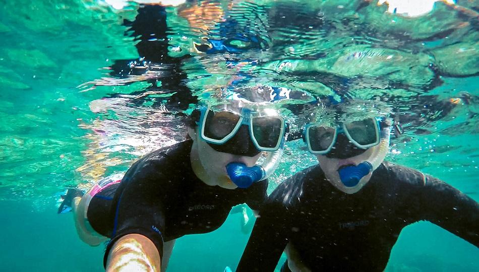 Aurelia Teslaru and Dan Moldovan snorkeling at Apo Island, Philippines