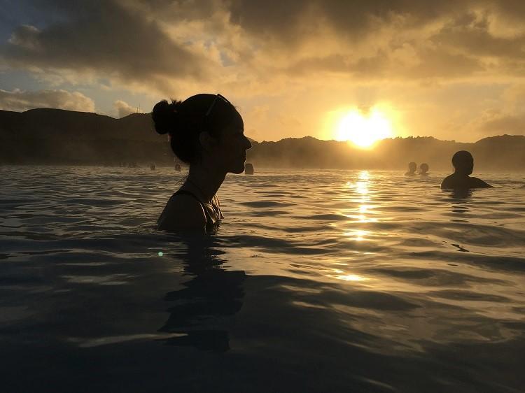 Girl at Blue Lagoon Iceland during sunset