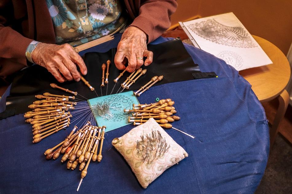 Lady making hand made lace in Bruges