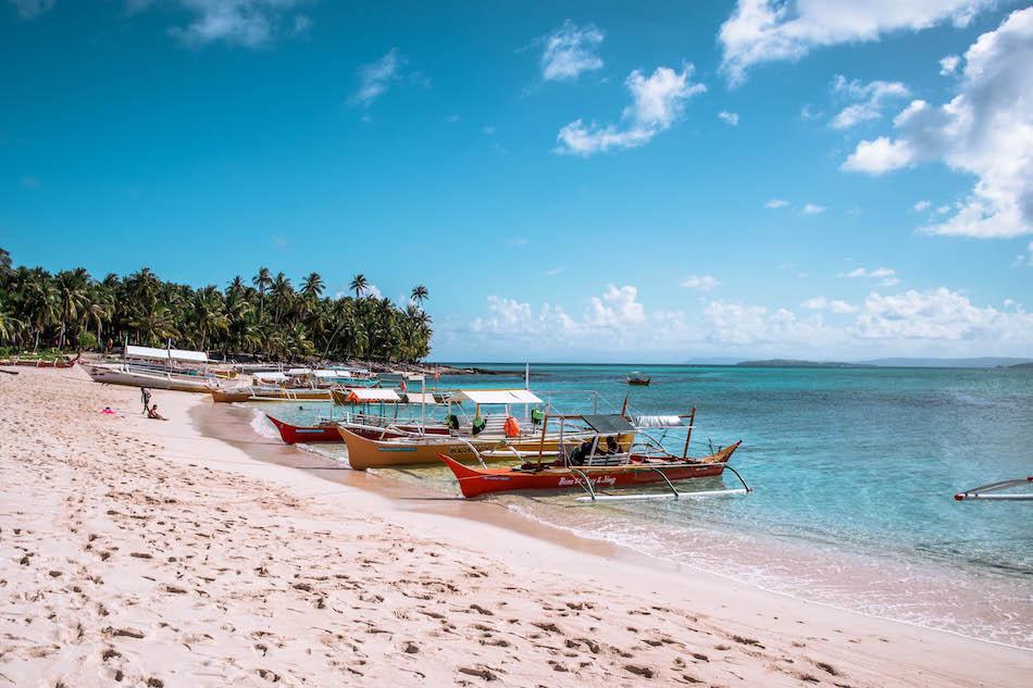 Daku Island Siargao beach and boats