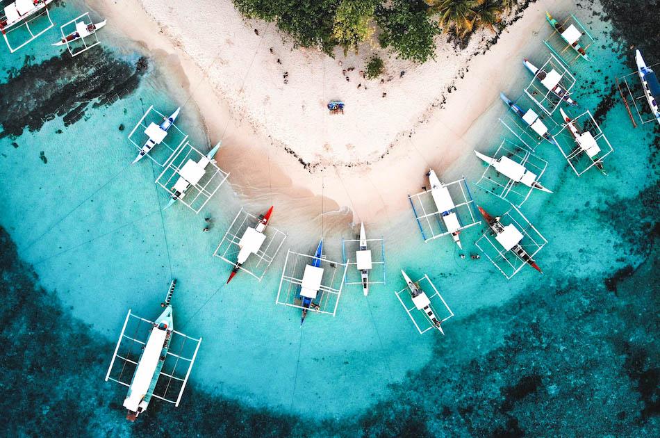 Daku Island Siargao drone photography. Boats at Daku Island Beach in Siargao
