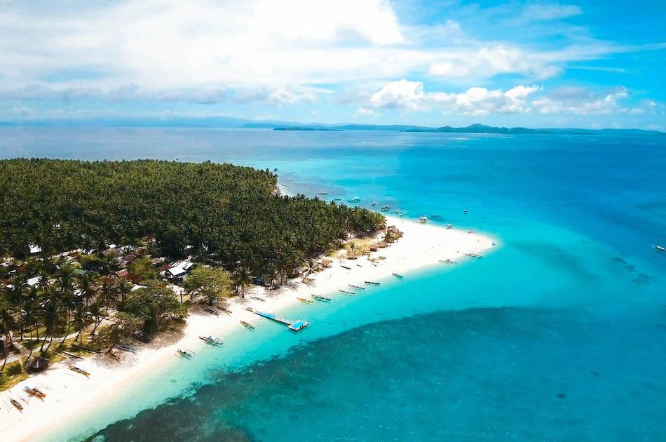 Daku Island Siargao drone photography. Boats at Daku Island Beach in Siargao
