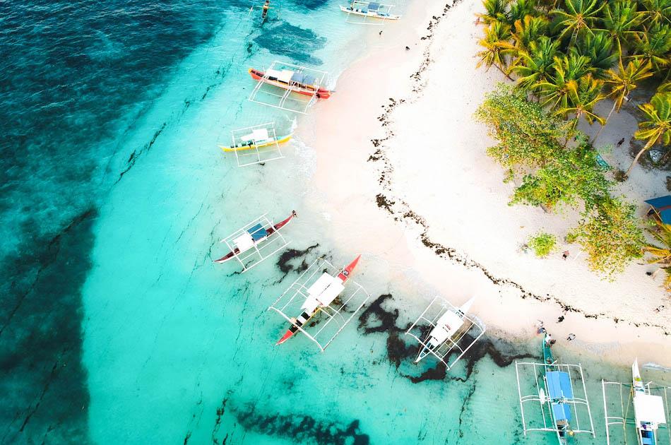 Daku Island Siargao drone photography. Boats at Daku Island Beach in Siargao