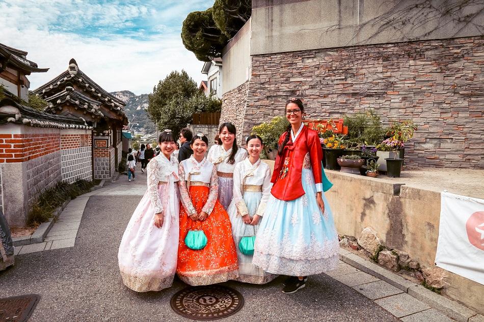 Foreign girl and Korean girls wearing a hanbok at Bukchon Hanok Village