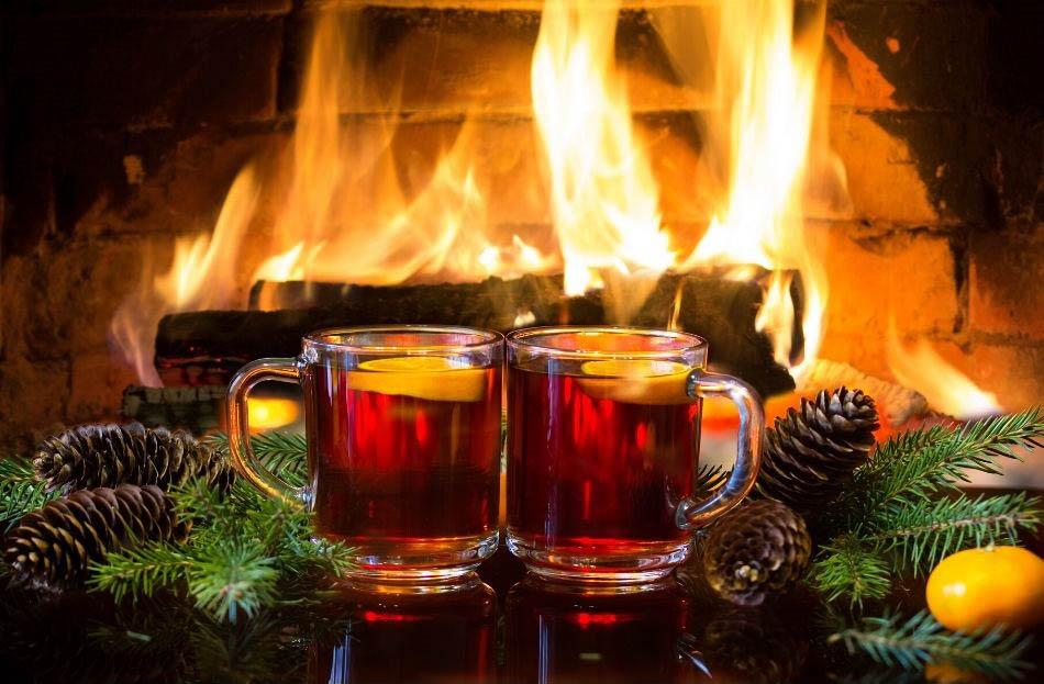 Glogi drink in front of fireplace in Lapland, Finland