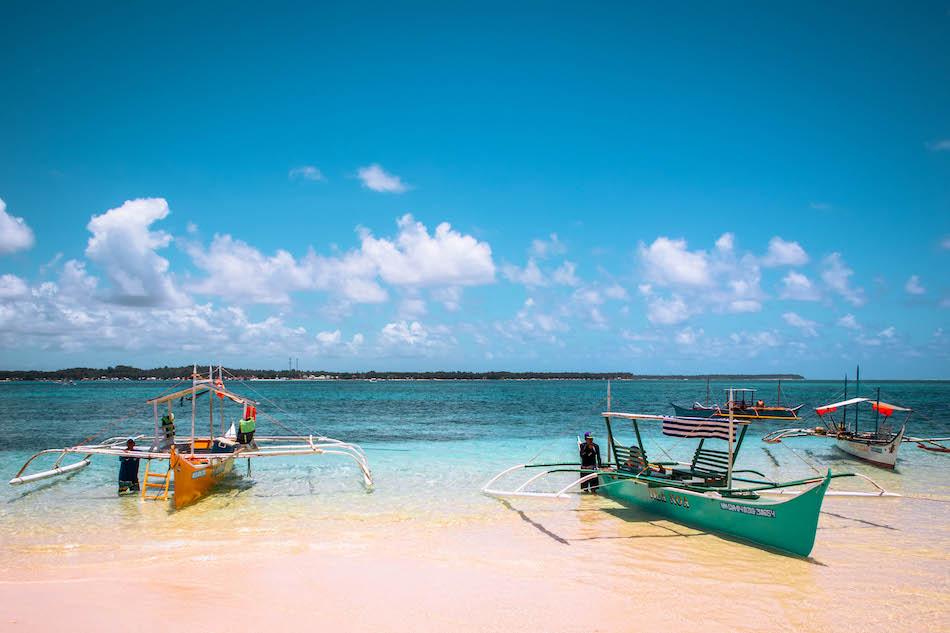 Boats at Guyam Island Siargao. Island hopping tour to Guyam Island