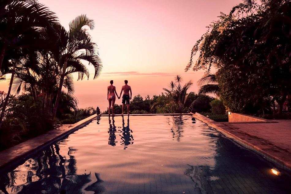 Couple in infinity pool at The Hamsa Resort Bali