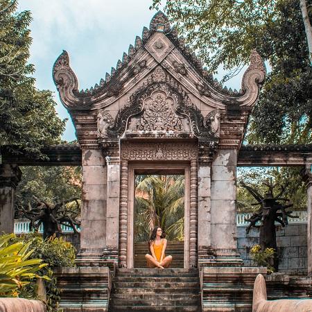 Girl at Independence Hotel Sihanoukville garden gate