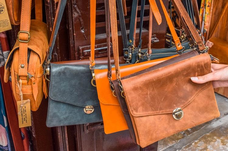 Leather bags at a market in Hoi An