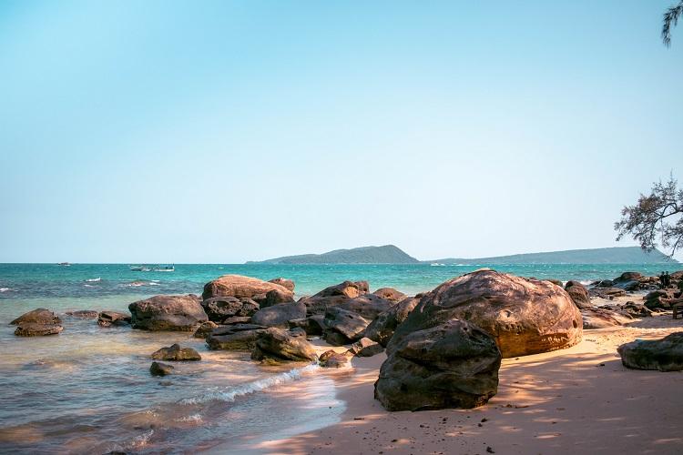Long Set Beach stones at sunset in Koh Rong