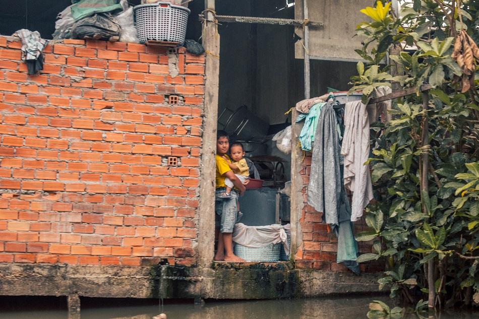 Children at Cai Rang floating market Mekong Delta Vietnam