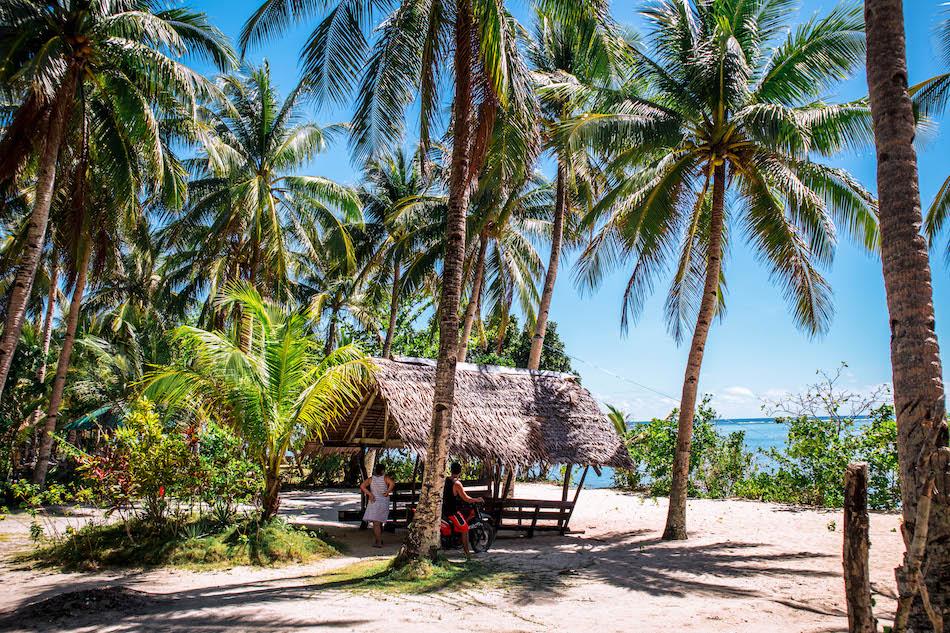 Bungalow at Pacifico Beach Siargao surrounded by palm trees