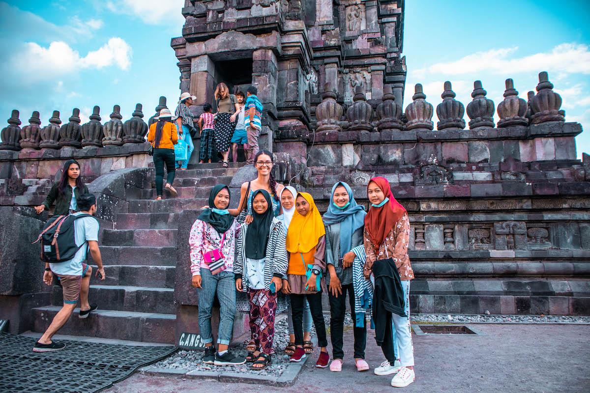 Aurelia Teslaru with a group of locals at Prambanan Temple, Yogyakarta