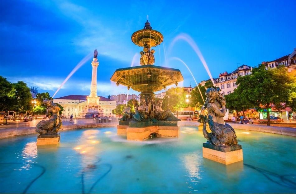 Rossio Square Lisbon during the night. The fountains are lit