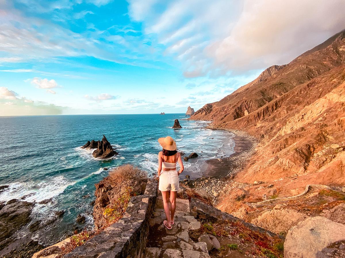 Girl climbing down the stairs to Benijo Beach, Tenerife. Playa de Benijo