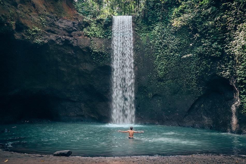 Swimming at Tibumana Waterfall Bali