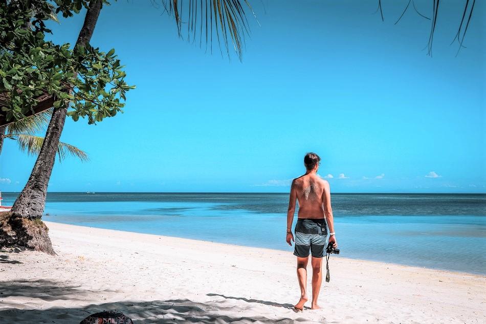 Guy walking on Tubod Beach, Siquijor
