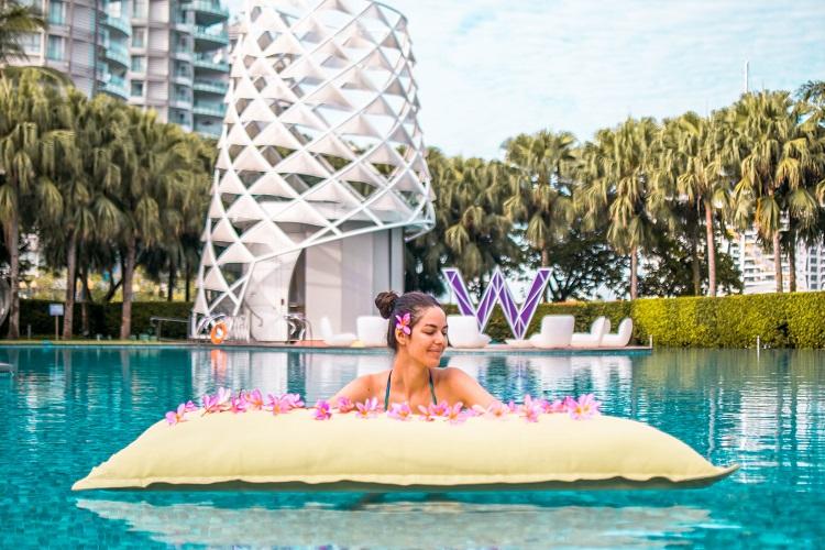 Girl at W Singapore Sentosa Cove Hotel Wet pool view